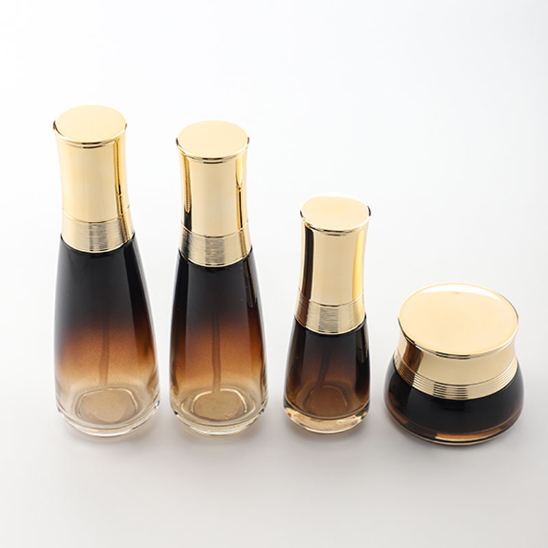 Cosmetic glass bottle set luxury skincare packaging container manufacturer new design with pump&spray&gold cap